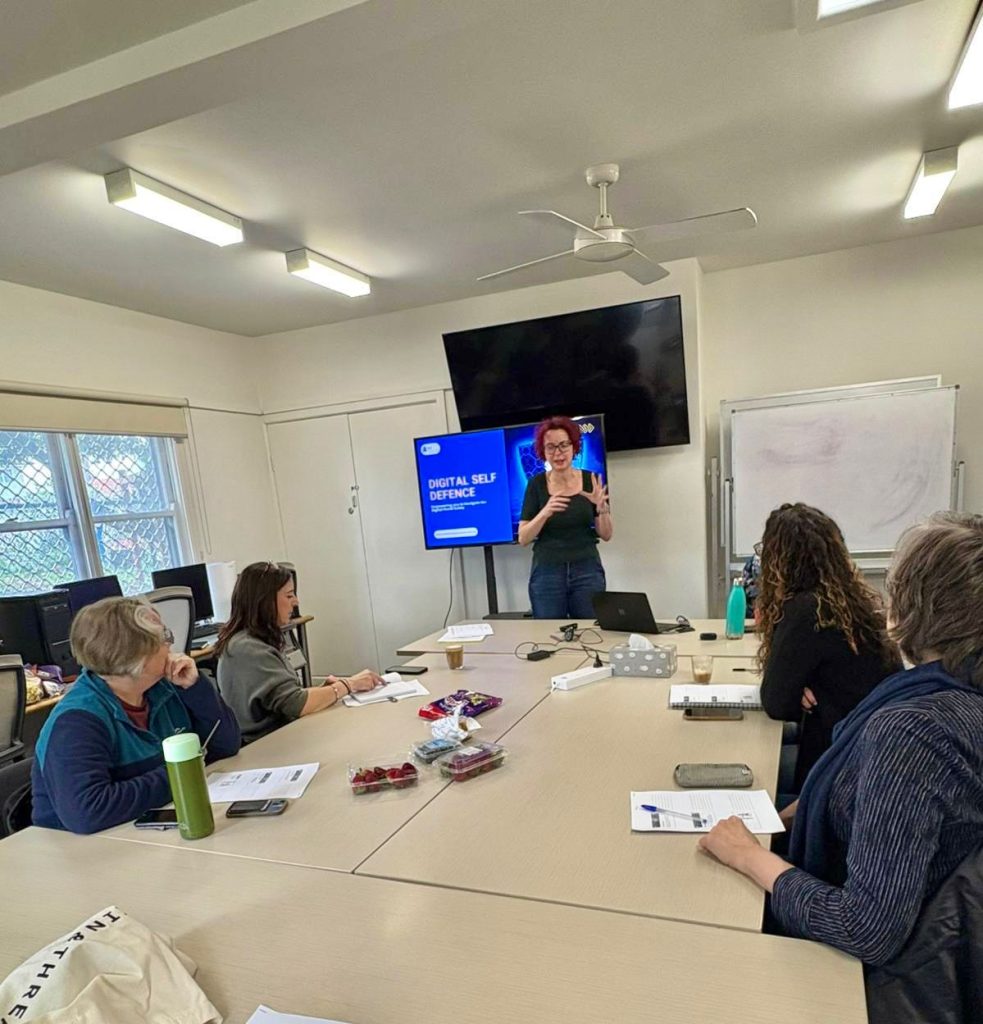 5 learners in a small room learning digital skills